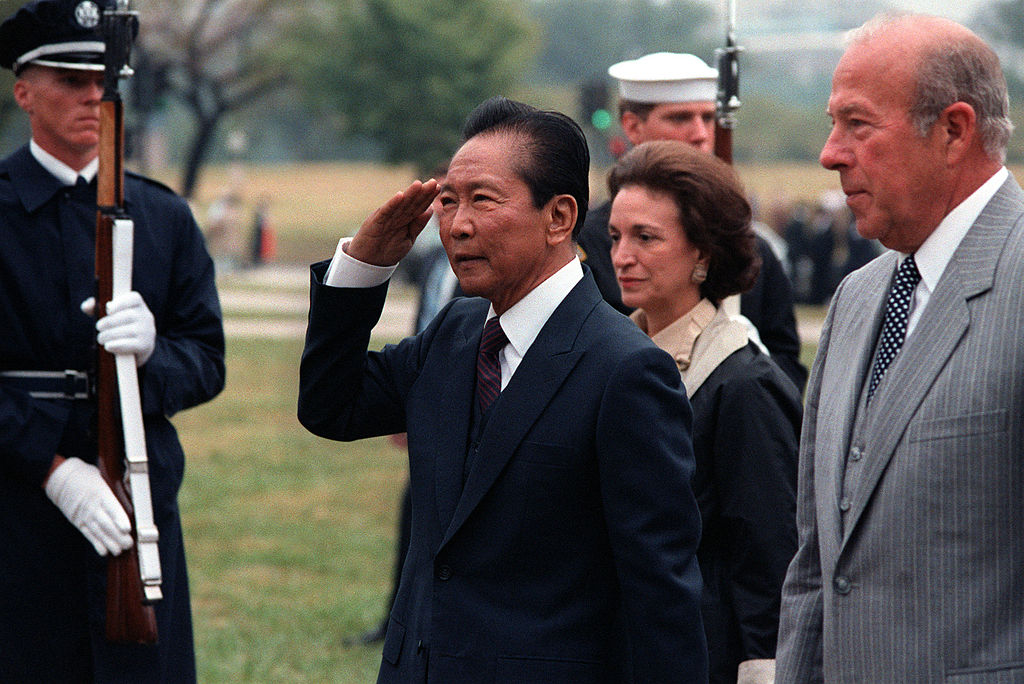 Former president and dictator Ferdinand Marcos with George Shultz. PHOTO: WIkipedia 