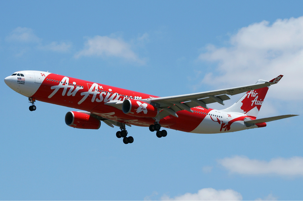 An AirAsia aircraft is seen in this undated file photo. An Airbus 330 in the carrier’s fleet had to turn around and go back to Australia on the weekend after technical difficulties that one passenger said had the plane “shaking like a washing machine.”