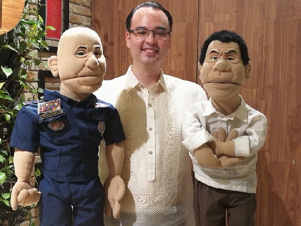 Sen. Alan Peter Cayetano with ‘Duterte’ and ‘Bato’ puppets FILE PHOTO