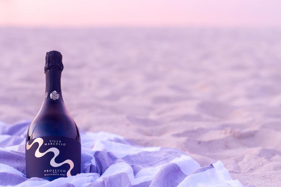 Bottle of champagne on a beach Bottle of champagne on a beach