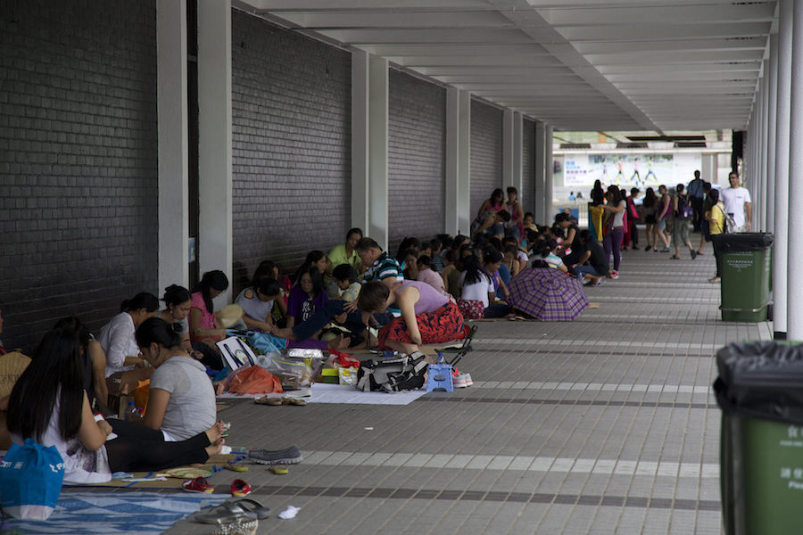 Domestic workers gather on their day off.