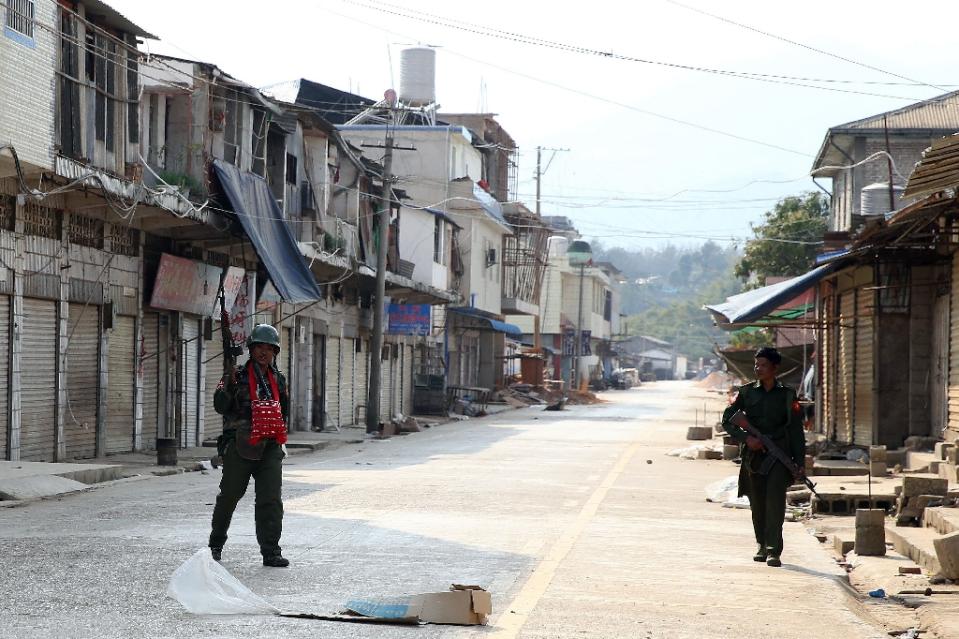 Soldiers on an empty street in Laukkai.
