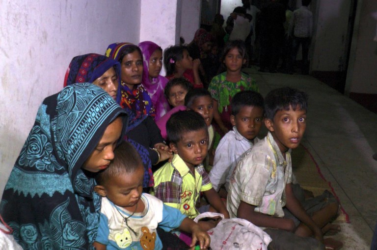 Bangladeshi villagers gather in a cyclone shelter following an evacuation by authorities in coastal villages in the Cox’s Bazar district on May 29, 2017 as Cyclone Mora gradually approaches towards the coastline. Photo: AFP