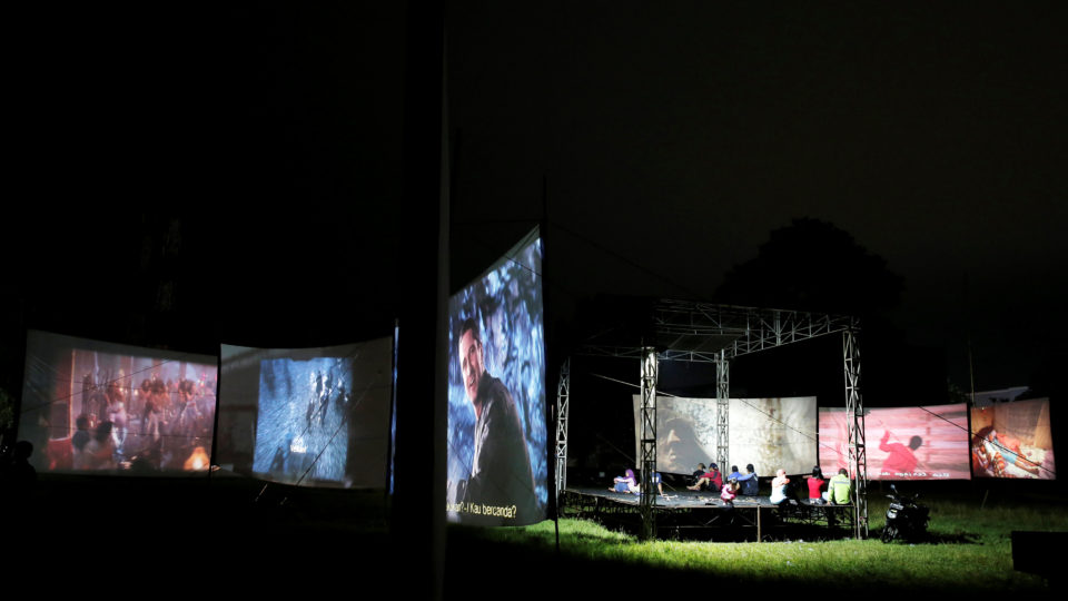 People watch films during a wedding party in Bogor, Indonesia, March 19, 2017. REUTERS/Beawiharta