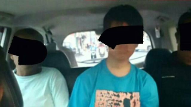 HP (middle) being transported to a police station following his arrest on Tuesday, May 23. Photo: Instagram/@polresbogor