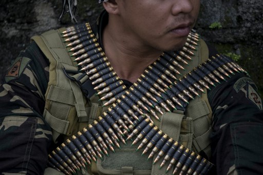 A soldier waits before conducting house-to-house clearing operations against Islamist militants in Marawi, on the southern island of Mindanao on June 7, 2017.  PHOTO: AFP, Noel Celis