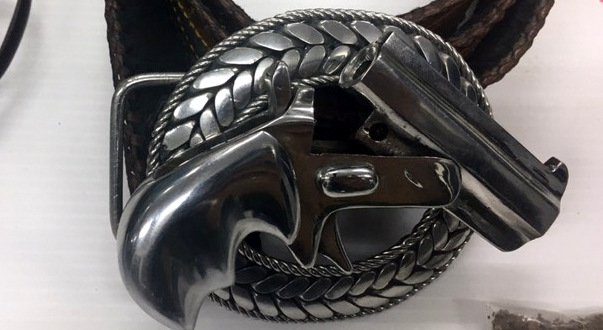 A Thalang Police photo of Bandit’s homemade belt buckle that contained a working gun. 