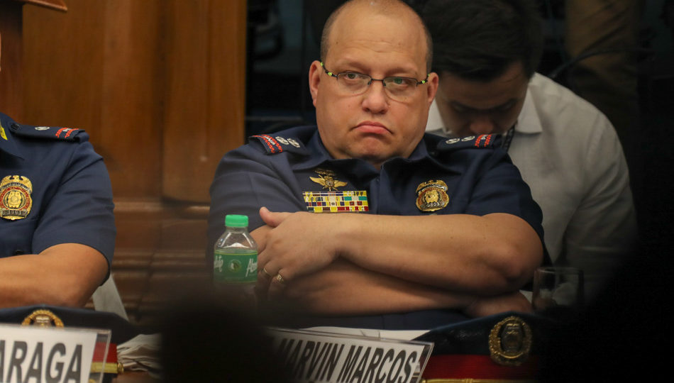 CIDG Region 8 chief Supt. Marvin Marcos  listens as alleged Cebu drug Lord Kerwin Espinosa appears at the Senate inquiry on illegal drug trade on Wednesday. File photo by Jonathan Cellona, ABS-CBN News