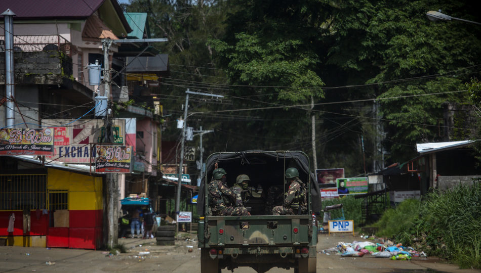 A jeepload of soldiers along an abandoned street in Marawi City. PHOTO: Fernando G. Sepe Jr., ABS-CBN News