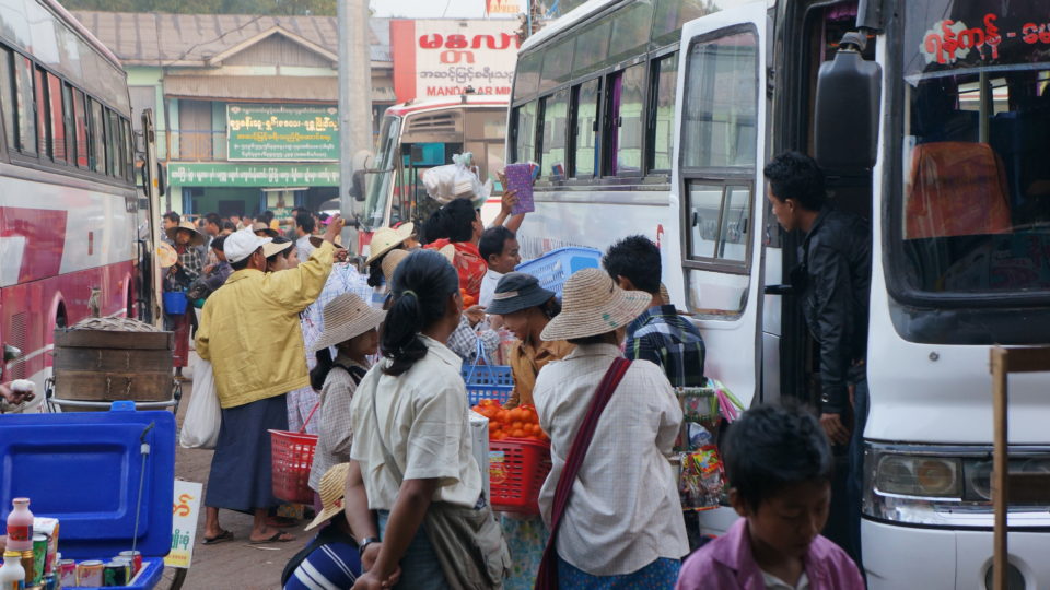 Hawkers ply their wares to passengers at the Aung Mingalar Bus Station in Yangon in this January 2013 photograph. Photo by Yangonite.com via WikiCommons