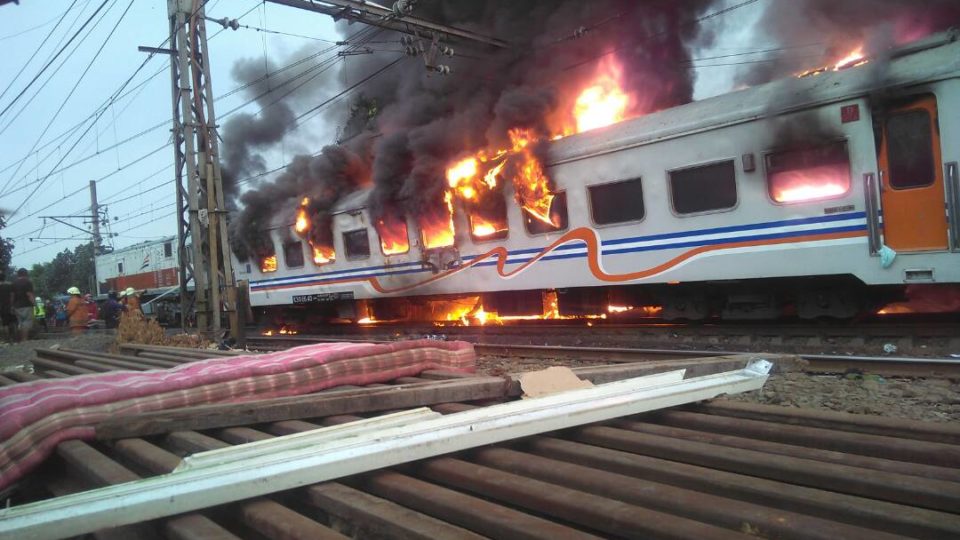 A train in Jakarta catching fire after colliding with a minivan on June 13, 2017. Photo: Twitter