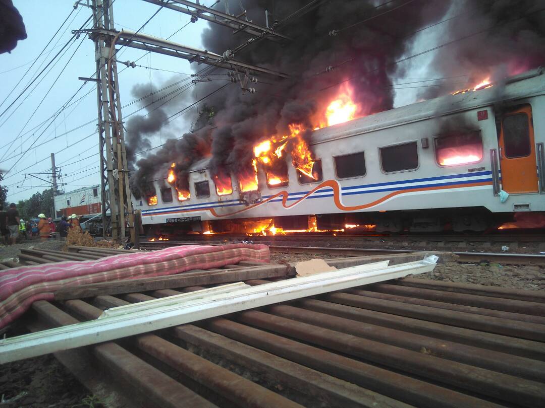 A train in Jakarta catching fire after colliding with a minivan on June 13, 2017. Photo: Twitter