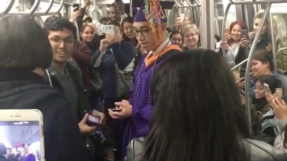 Fil-Am Jerick Alcantara graduates inside a subway train in New York City. PHOTO: Screengrab from Facebook video