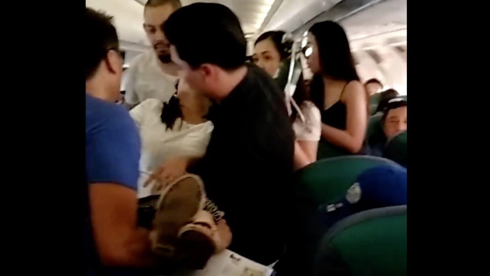 A woman passed out inside a “freakin’ hot” Cebu Pacific flight. PHOTO: Screengrab from Gin Durano’s Facebook video