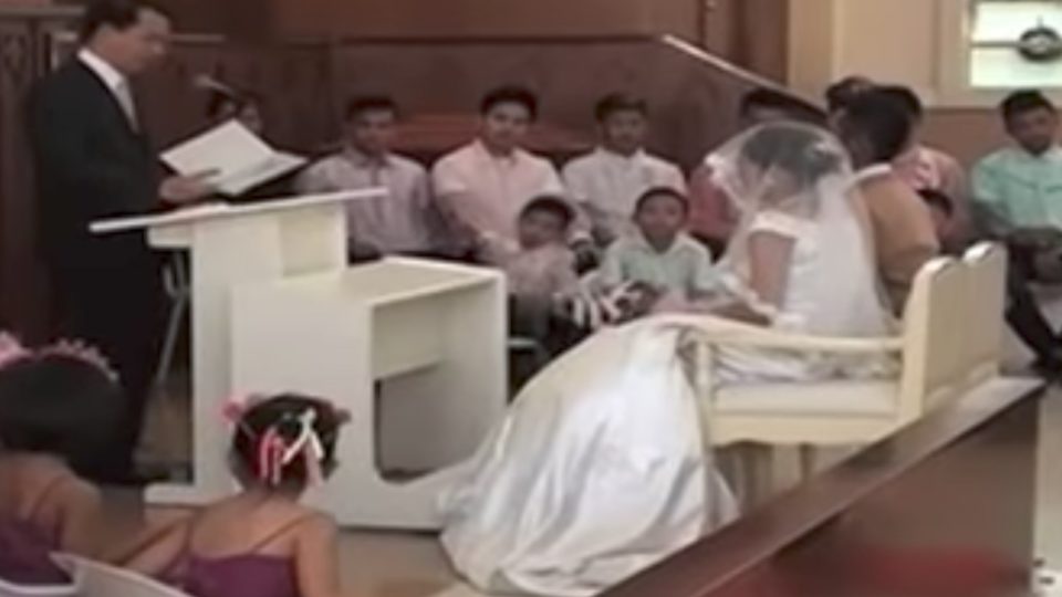 Roy and Charo Jane Bantasan’s wedding inside the evacuation center in Iligan. PHOTO: Screenshot from ANC report