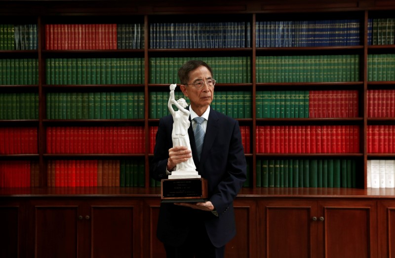 Martin Lee, a former lawmaker and founding chairman of the Democratic Party, is known as the “Father of Democracy”. In this picture, taken on May 21, 2014, Lee poses with a model of the Goddess of Democracy statue at his office. Photo (for illustration): Bobby Yip/Reuters