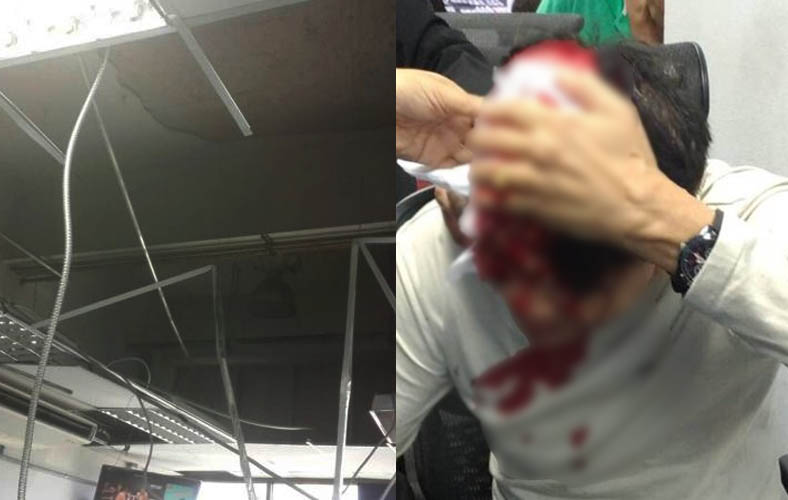 Passenger Buncha Sangguanam, 58, was left with a head injury when a large section of ceiling inside the Phuket International Airport collapsed on him, June 3, 2017. Photo: Tourist Police/ The Phuket News