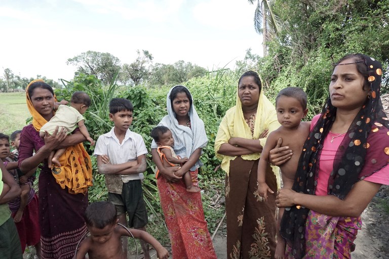 This photo from July 15, 2017, shows L-R: Ayamar Bagon, 20, Hasamithaya, 18, Laila Baygon, 35 and Hasinnar Baygon, 20, who claimed soldiers raped them during clearance operations last year in Kyar Gaung Taung village in Maungdaw, Rakhine State. PHOTO: AFP / Hla Hla Htay