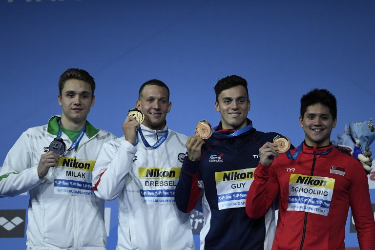 (L-R) Hungary’s Kristof Milak, US Caeleb Remel Dressel, Joint 3rd Great Britain’s James Guy and Singapore’s Joseph Schooling celebrate on the podium. Photo: Christophe Simon/ AFP
