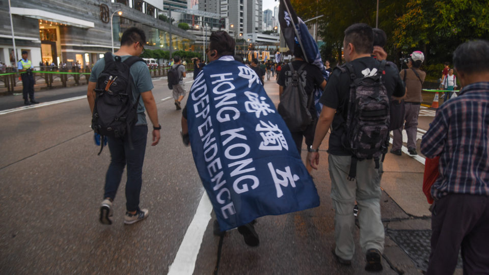 A protester wears a Hong Kong Independence flag at the annual democracy march, July 1, 2017. Photo: Annette Chan/Coconuts Media