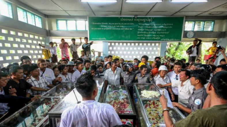 More than 1,000 people attended the family’s funeral in the wake of the murder. Photo: Aung Naing Soe