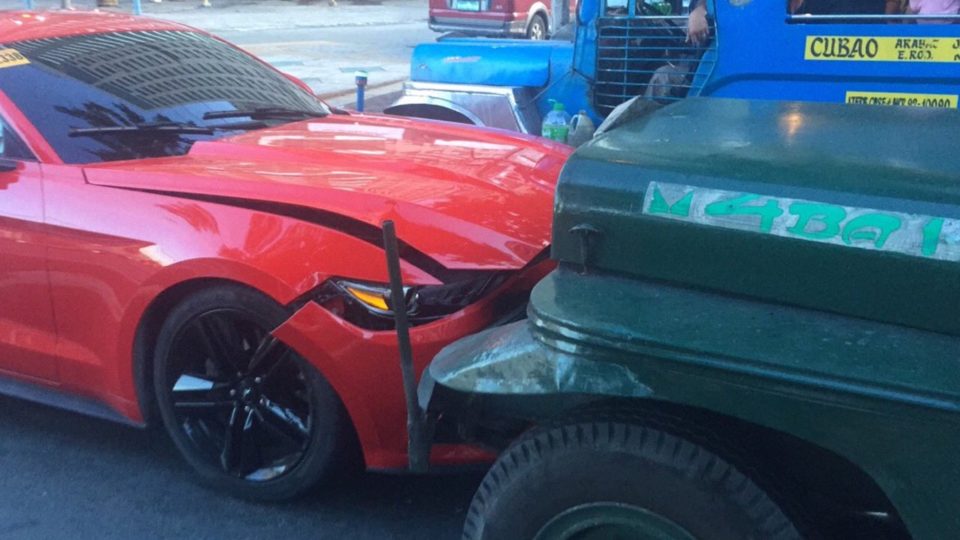 Mustang meets its match: a passenger jeepney PHOTO: Twitter/Kevin Manalo