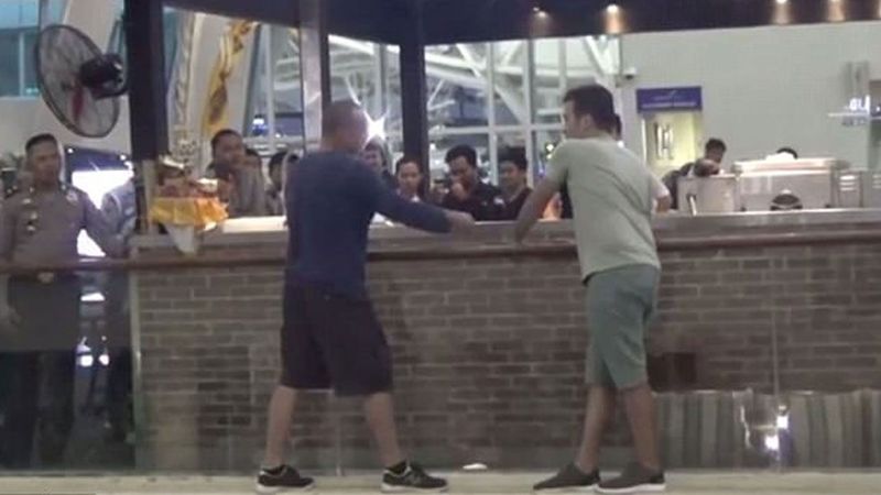 Man on a Ledge: The Australian hangs on to a second-floor ledge as an Austrian man tries to talk him down. 