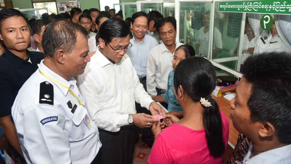 Vice President Henry Van Thio presents a farming permit to a farmer in Madaya Township on July 12. Photo: MNA