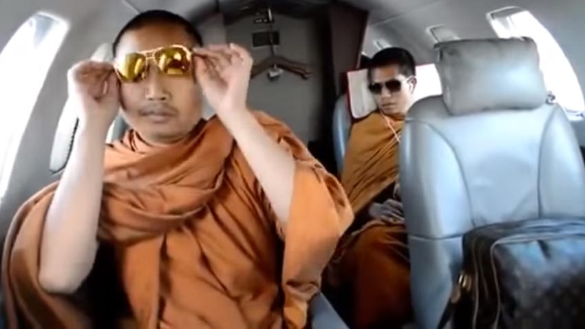 A video leaked in 2013 shows Wirapol Sukphol, formerly known as “Luang Pu Nen Kham,” traveling on a private jet and carrying a Louis Vuitton bag.