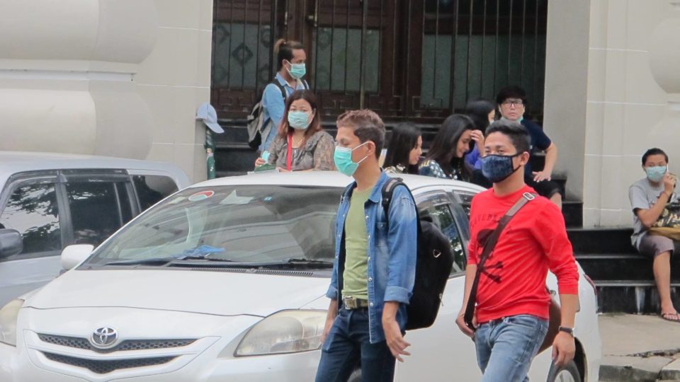 Yangon residents wear face masks after news spreads of a swine flu outbreak. Photo: Facebook / News Watch