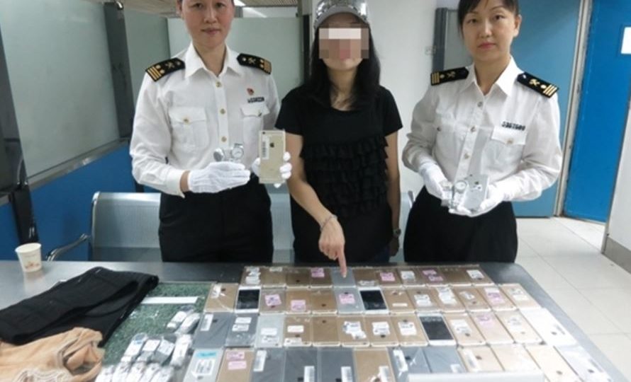 One woman had a whopping 102 iPhones and 15 Tissot watches strapped to her body. Photo: Luohu Customs