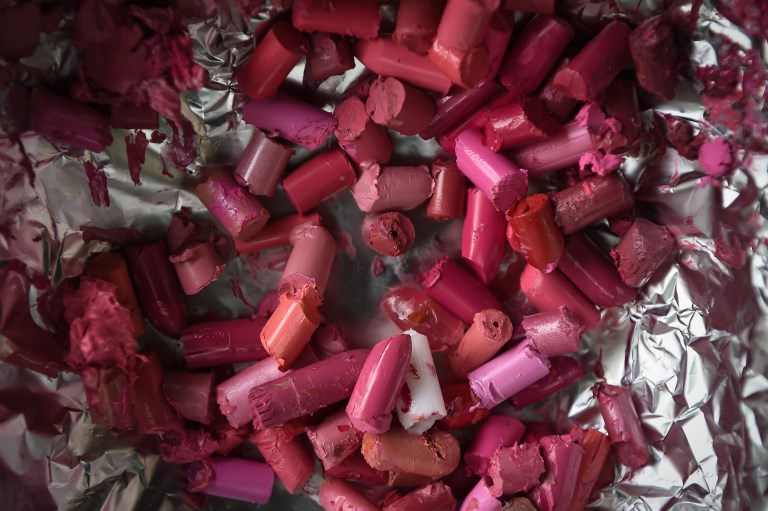 Recycled tubes of lipstick ready to be melted over a stove in Bangkok. 
