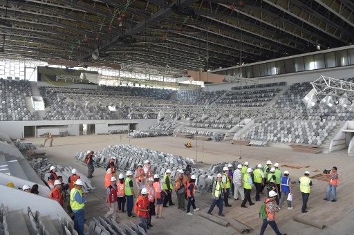 Officials from Olympic Council of Asia (OCA) visit the Istora stadium at the Senayan sport complex as the Indonesian Asian Games Organizing Committee (INASGOC) prepares for the 18th Asian Games in Jakarta on August 6, 2017.
Indonesia will host the 18th Asian Games in Jakarta and Palembang in 2018 with 39 sports, 53 disciplines and 426 events. / AFP PHOTO / ADEK BERRY