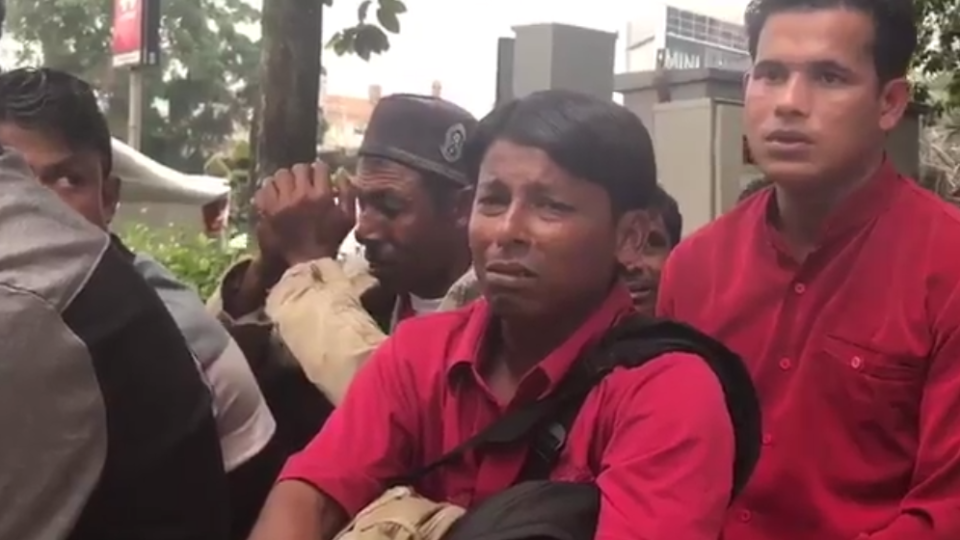 Men arrested for immigration offenses after participating in the protest against Myanmar. Photo: Twitter / Melissa Goh