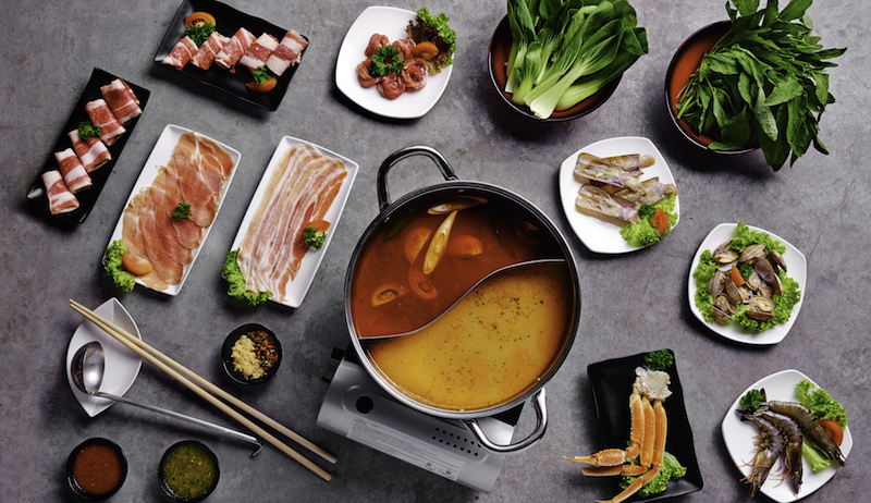 Tom yum and tomato hot pot. Photo: Jin Ho Mia