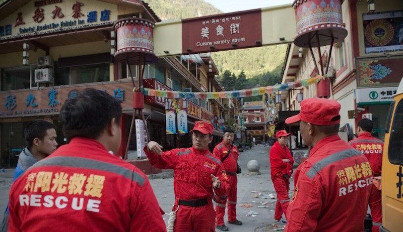 Members of a Chinese rescue team prepare to search for earthquake survivors in Zhangzha in southwest China’s Sichuan province on August 10, 2017. 
The 6.5-magnitude earthquake struck Sichuan province late on August 8, tearing cracks in mountain highways, triggering landslides, damaging buildings and sending panicked residents and tourists fleeing into the open. Photo: Nicolas Asfouri/AFP 
