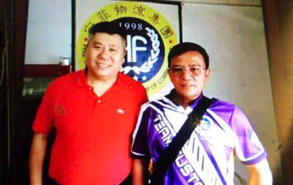Businessman tagged in drug smuggling takes photo with  Bureau of Customs Commissioner Nicanor Faeldon. Photo from ABS-CBN News