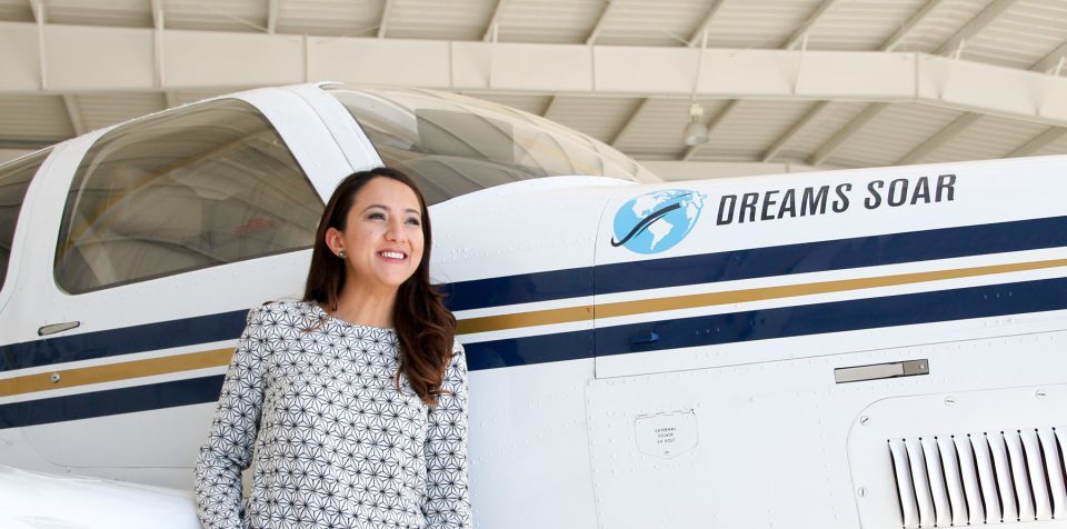 Former Afghan refugee, Shaesta Waiz, and her plane. Photo via Dreams Soar