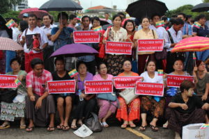 Supporters of State Counsellor Aung San Suu Kyi watch her speech on the big screen outside Yangon's City Hall. Photo: Jacob Goldberg