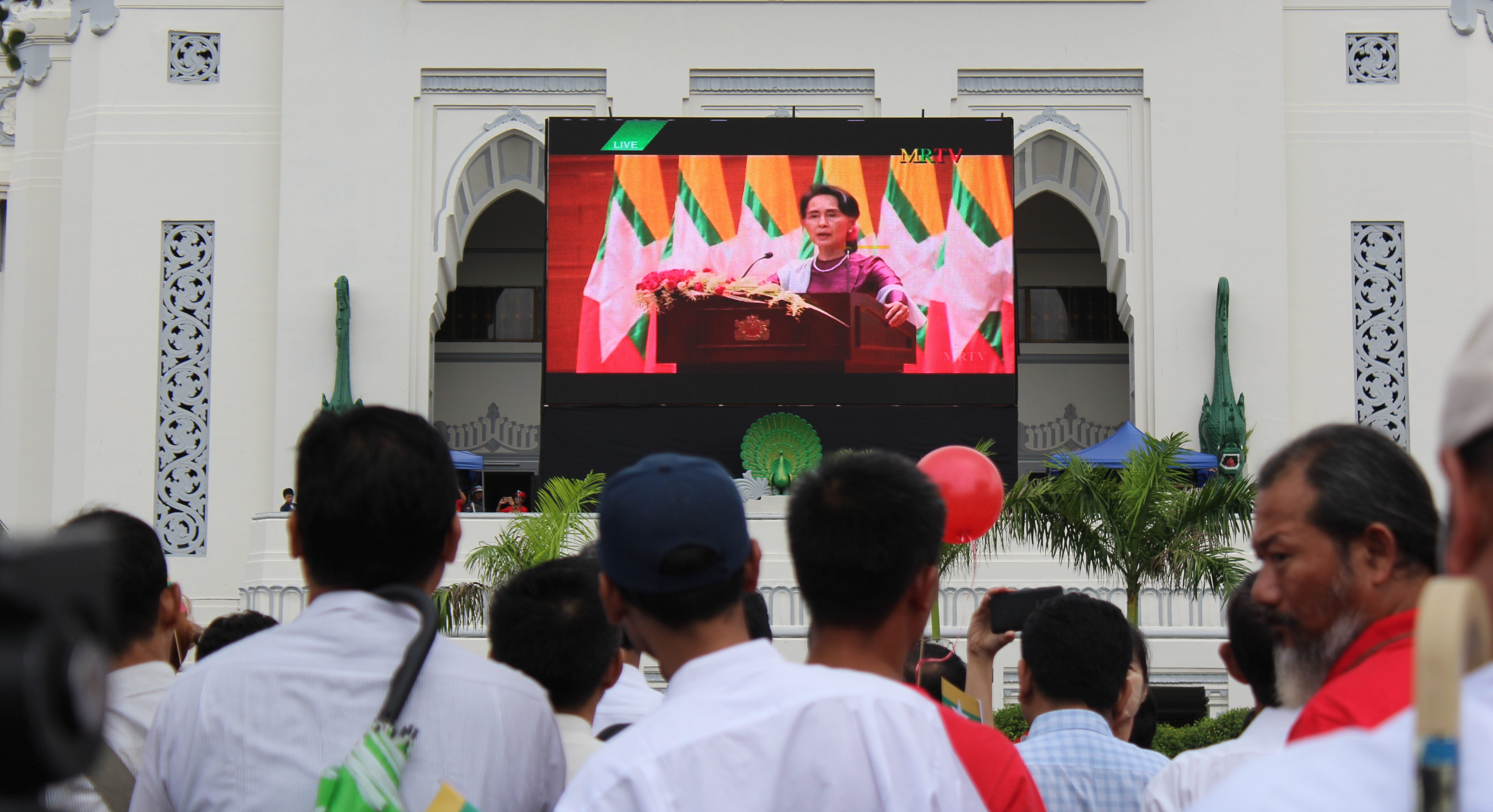 Crowds gather outside Yangon City Hall to watch Aung San Suu Kyi’s speech on Rakhine State on September 19, 2017. Photo: Jacob Goldberg