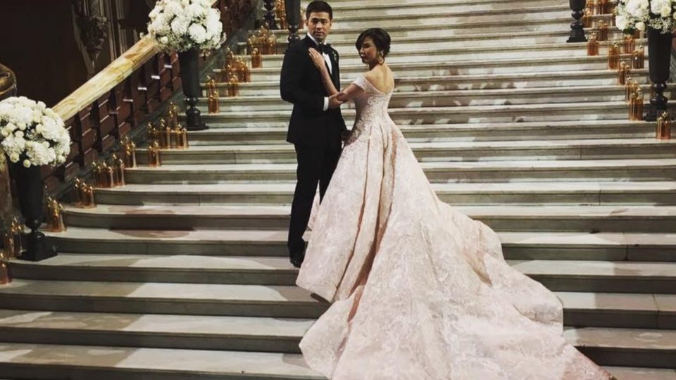 The stunning newlyweds pose for a photo by the grand staircase. PHOTO: Instagram/Belo Beauty