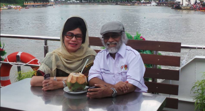Minister Datuk Seri Fatimah Abdullah, enjoying a riverside coconut with her husband via Facebook