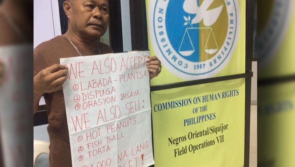 Jess Cañete, head of the Commission on Human Rights in Negros Oriental, holds a menu of services to help augment their agency’s P1,000-budget. PHOTO: Annie Perez/ABS-CBN News