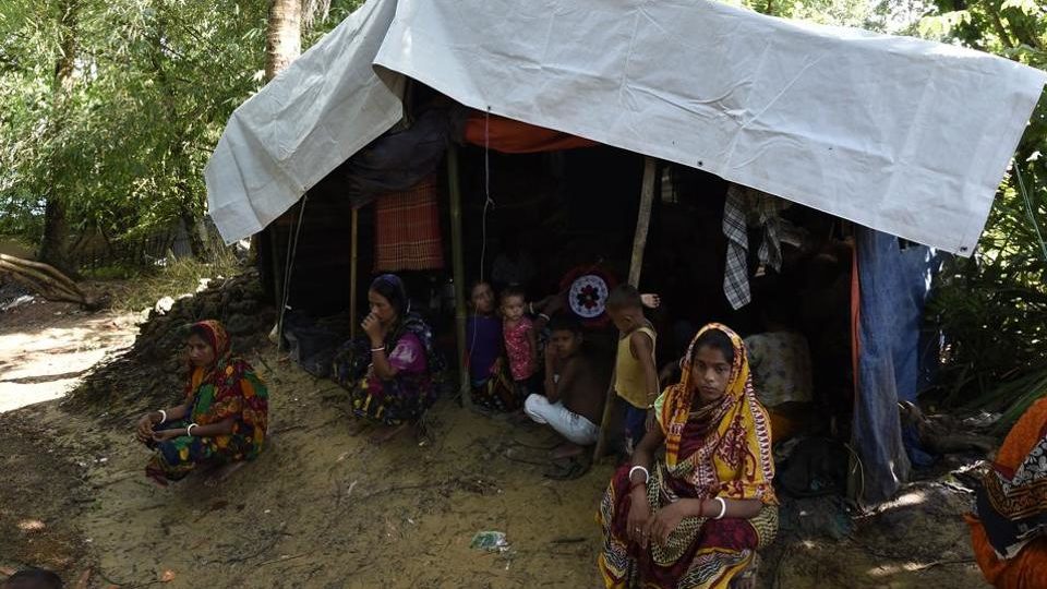 Hindu refugees from Myanmar seat outside their makeshift shelter in a Hindu village near the Bangladeshi town of Kutupalong. Photo: DOMINIQUE FAGET / AFP