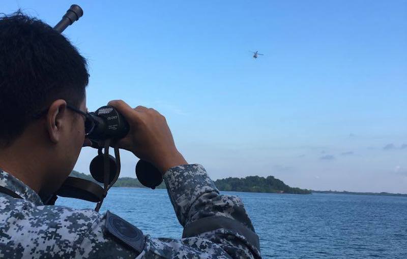 RSN Patrol Vessel RSS Fearless and RSAF Super Puma Rescue 10 at the search and rescue operations. Photo: Ng Eng Hen / Facebook
