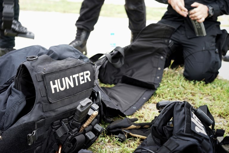 In this photo taken on August 24, 2017, a Thai policeman from the Narcotics Suppression Bureau Division 3 loads an ammunition magazine while he and others undergo firearms training at a camp in Hua Hin, southern Thailand.
‘Yaba’ tablets, small methamphetamine pills cut with caffeine, are flooding the kingdom at record rates, along with a high purity and more addictive crystal version called ‘ice’, as drug lords in neighboring Myanmar churn out huge amounts into the region. In the year to September 18, Thai drug cops seized 199 million yaba pills, worth around US$1.2 billion on the local market, double the 2016 figure.  AFP PHOTO: Aidan JONES
