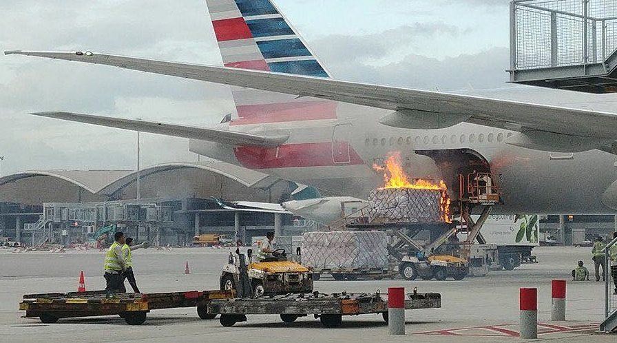 Cargo container catches fire while being loaded into an American Airline plane at Hong Kong International Airport.