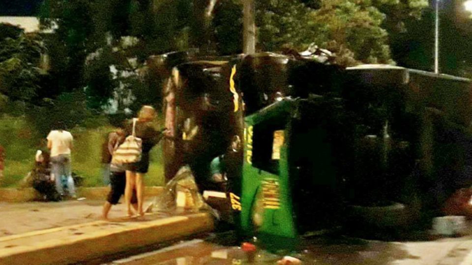 The Cher Bus lies on its side after falling off the Alabang flyover in Muntinlupa City. PHOTO: Facebook/Josh Castro