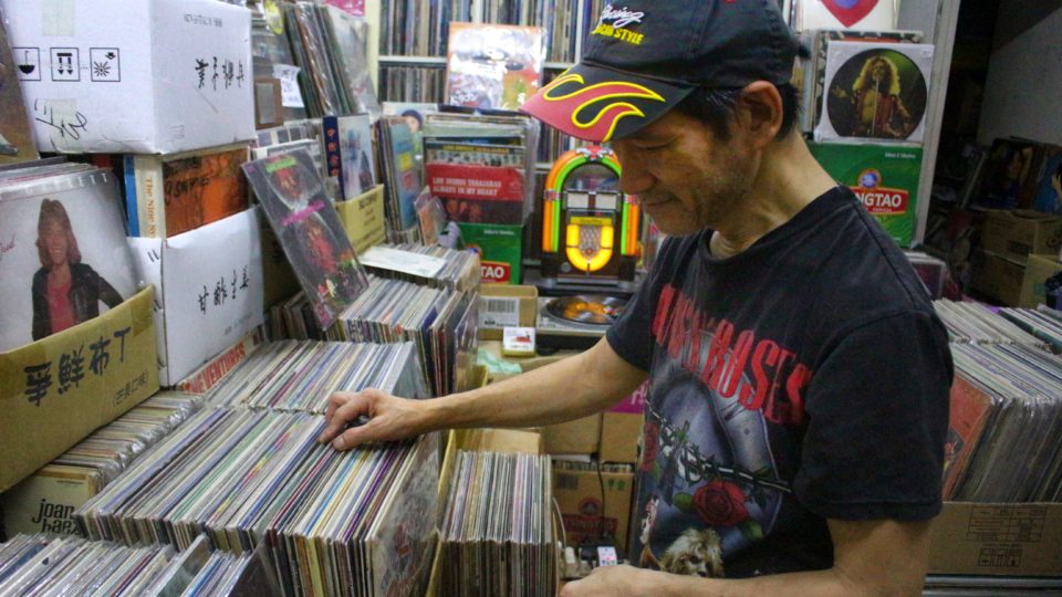 Paul Au, the self-proclaimed vinyl hero of Hong Kong, browsing through his vinyl collection. Photo by Vicky Wong.