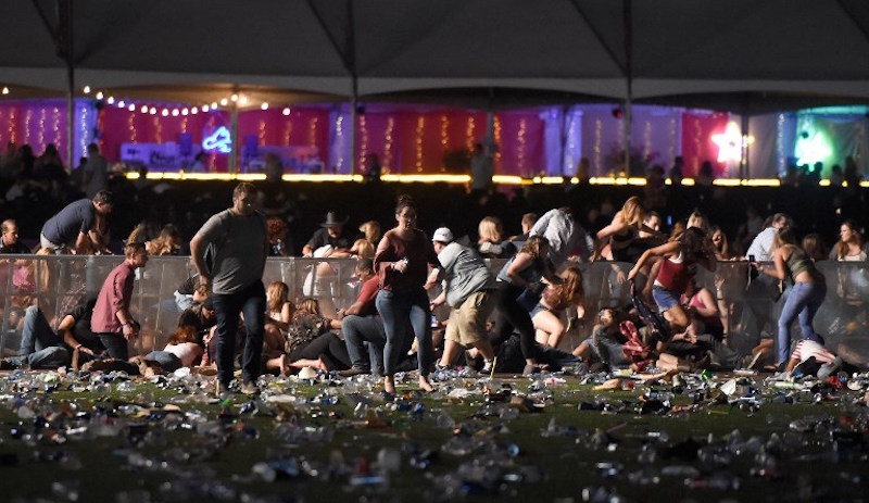 People run from the Route 91 Harvest country music festival after apparent gun fire was heard on October 1, 2017 in Las Vegas, Nevada. Photo: David Becker/Getty Images/AFP